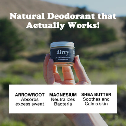 Hand holding up Dirty Natural Deodorant with trees and hills in the background. With text overlay that reads Natural Deodorant that actually works