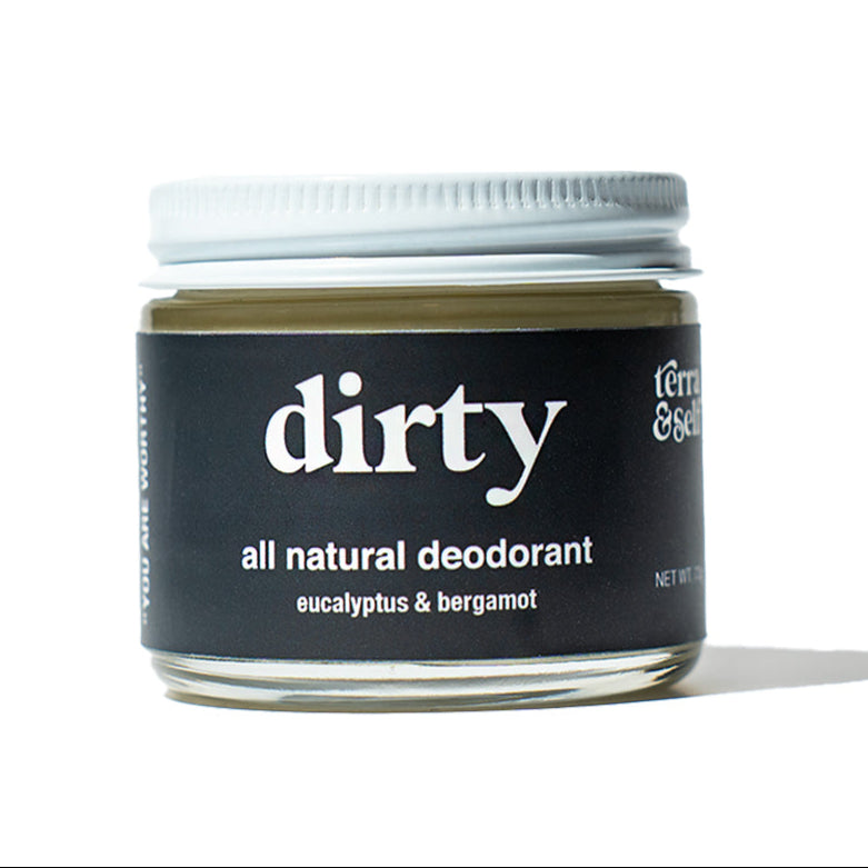 Dirty natural deodorant jar against white background
