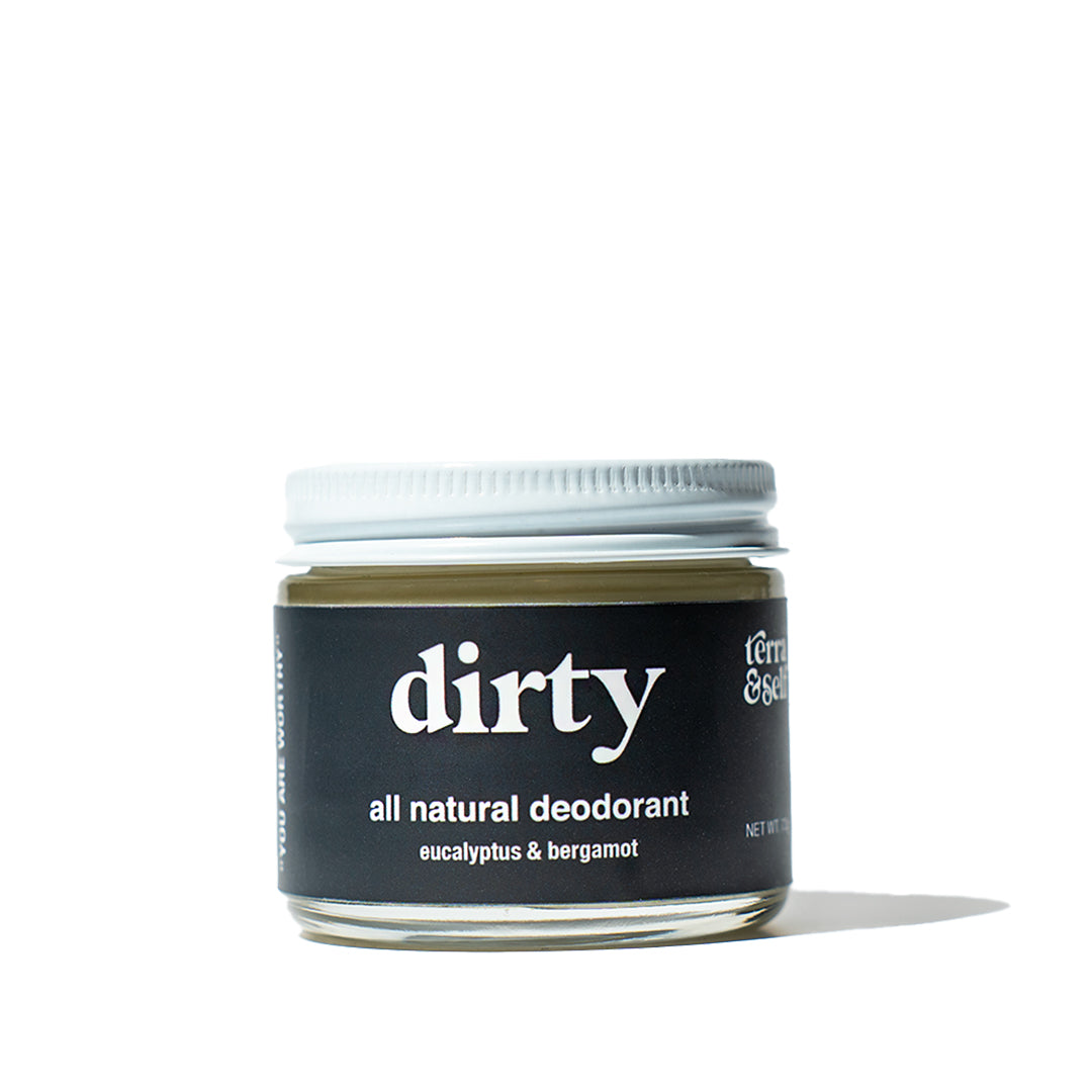 Dirty natural deodorant jar against white background