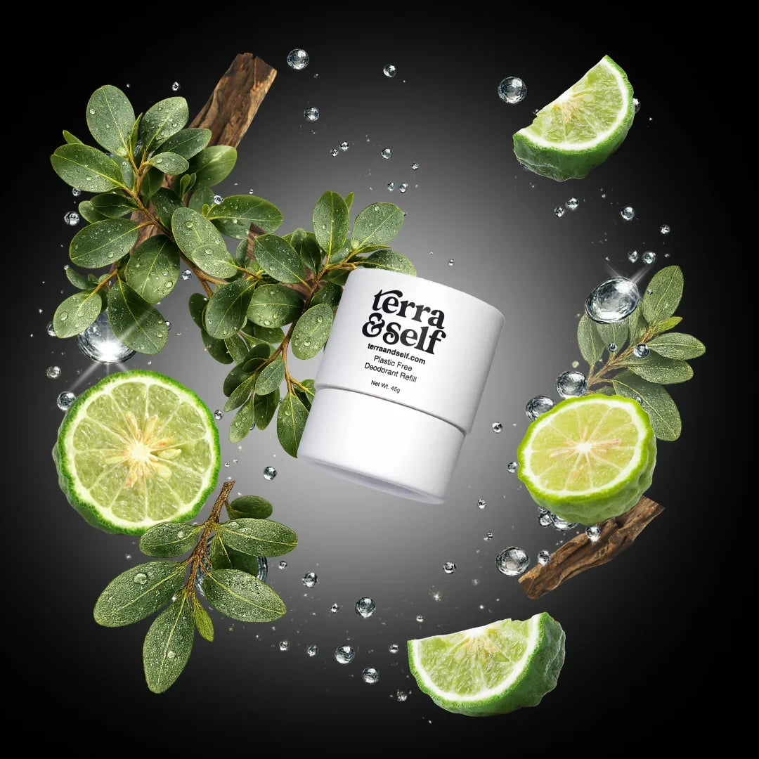 Plastic-free deodorant refill surrounded by citrus slices, green leaves, and water droplets.