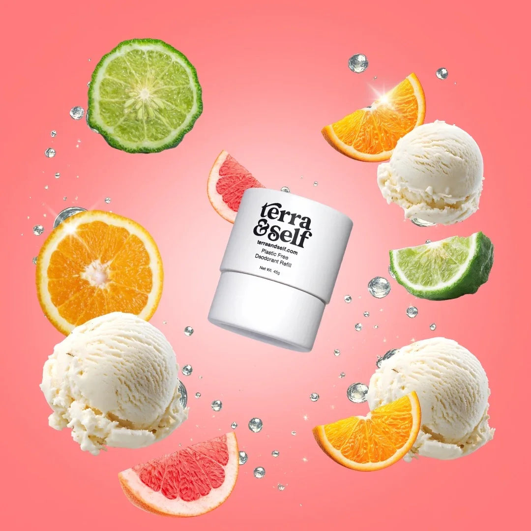 Deodorant refill with citrus slices, vanilla scoops, and water drops on a pink background