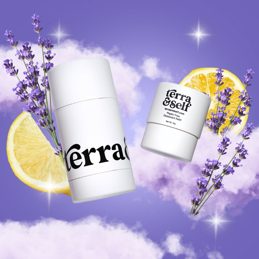 Terra & Self reusable deodorant applicator and plastic-free refill floating among soft purple clouds against a lavender sky, accented with sprigs of lavender, lemon slices, and twinkling star-shaped light flares.
