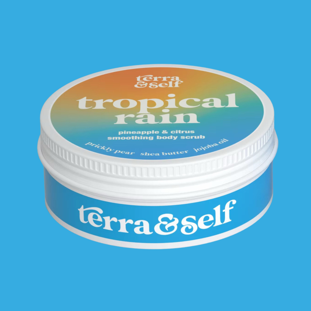 Tropical Rain Scrub tin against turquoise blue background