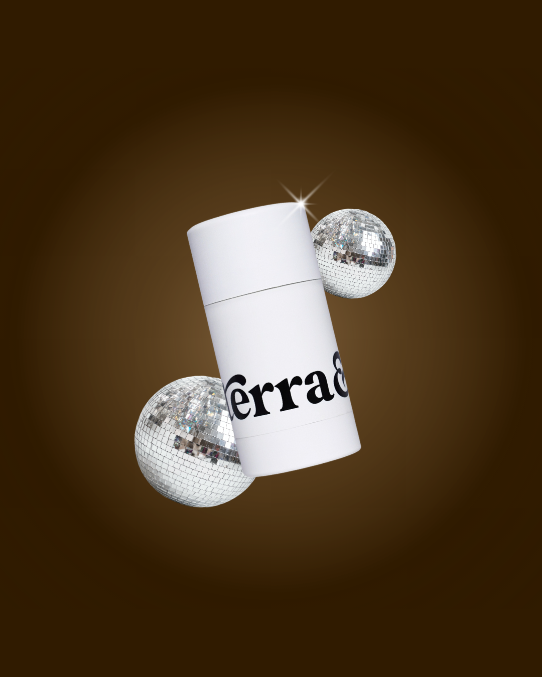 Terra & Self reusable deodorant applicator flanked by two silver disco balls against a dark brown background with a soft glow.