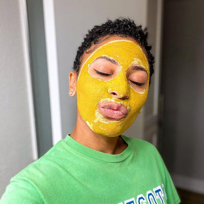 Acne Exfoliating Clay Mask, Inner Glow, shown on a model. This purifying clay mask is sustainable and small batch beauty.